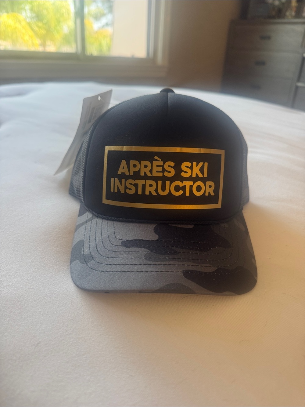 Black 'Après Ski Instructor' Trucker Hat with Gray Camo Bill